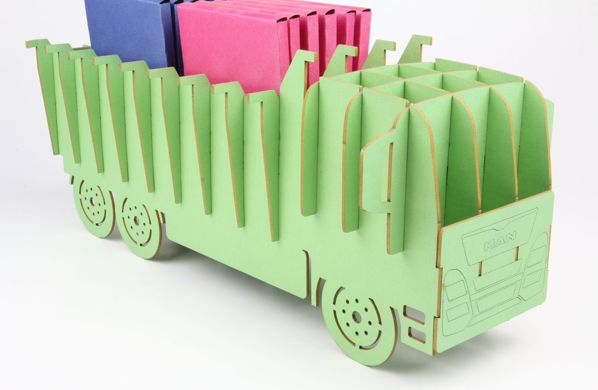 A model of a truck made of a colored cardboard cut by laser technology