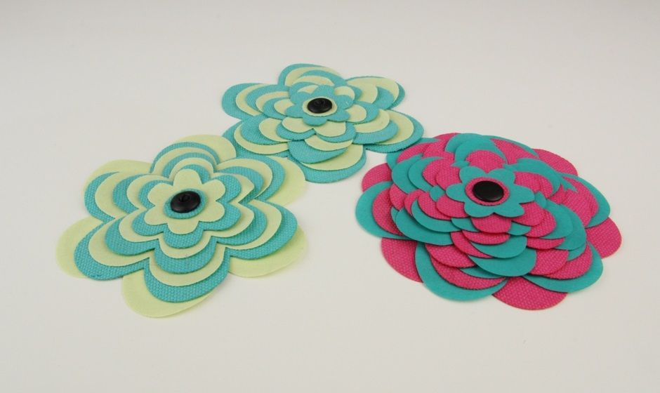 Laser cutting of colorful fabric flowers for decoration