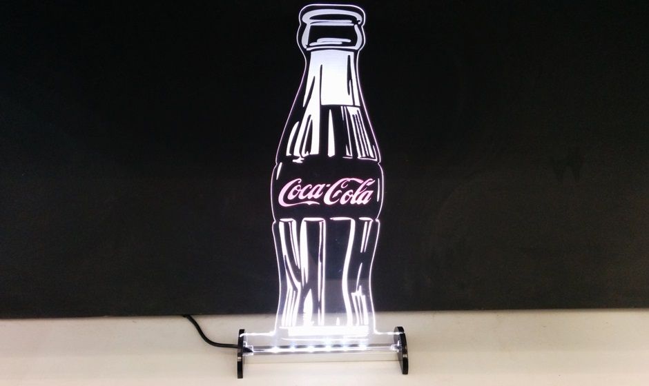 Laser cutting and engraving of advertising product illuminated with LED lighting