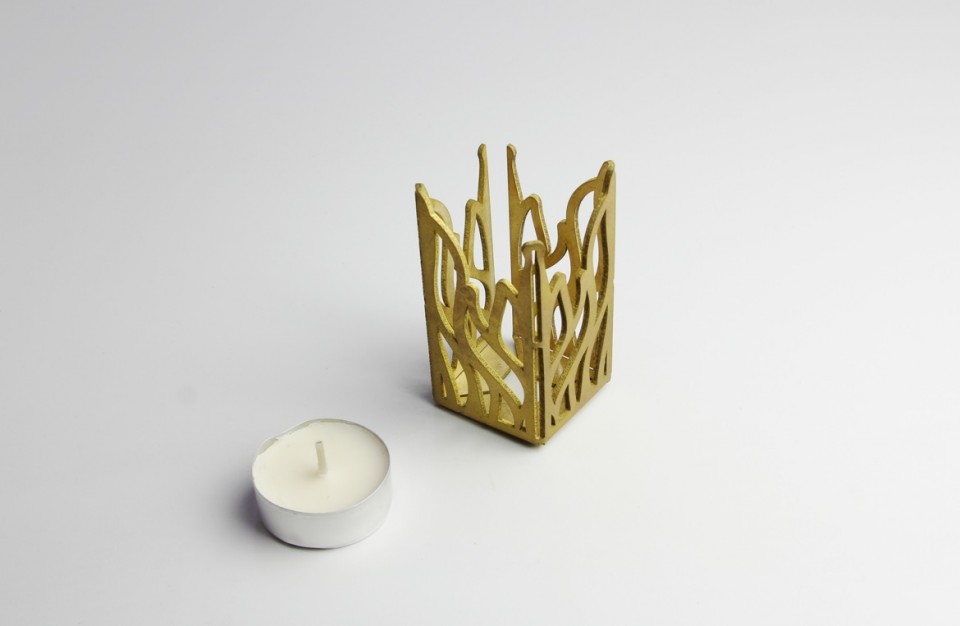 Laser cutting of 2mm thick brass and bending to create a candle-shaped stand