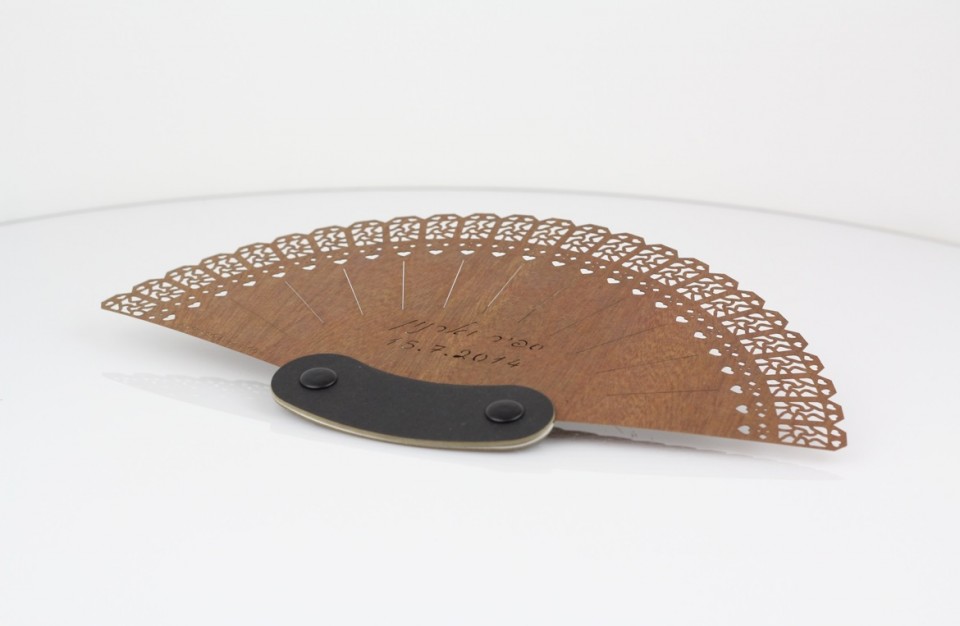 Laser cutting of a personal branded hand fan for a wedding party