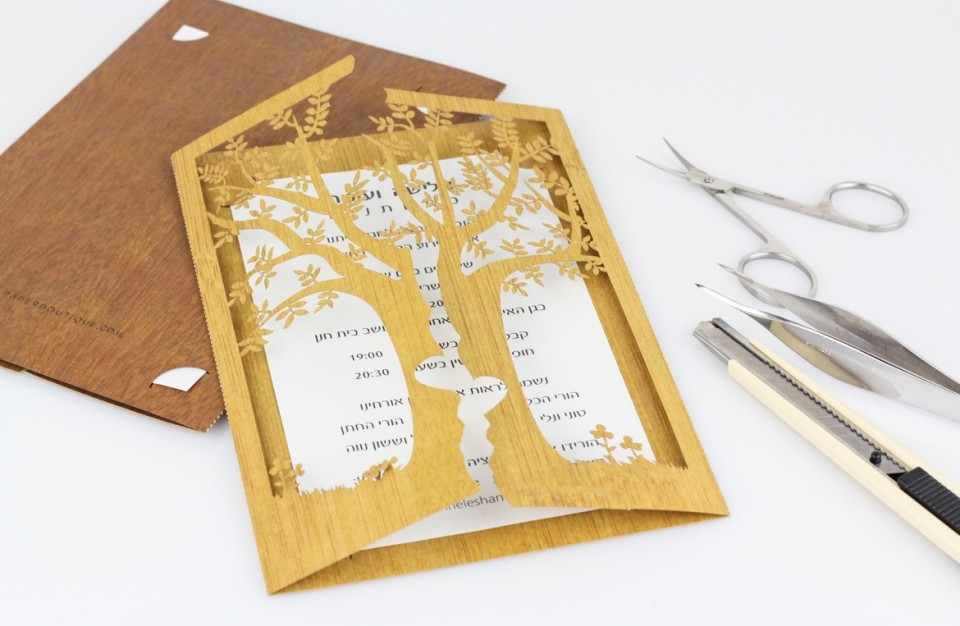 Designed invitation cut with a laser made of wood like paper