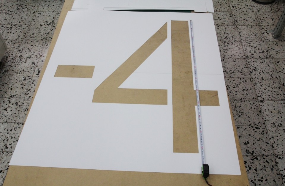 Laser cutting of a large stencil for painting of parking lots
