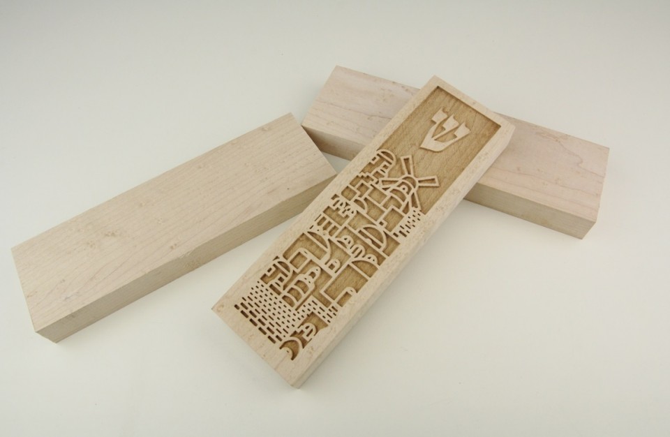 Laser engraving of jewish graphic for a mezuzah on maple wood