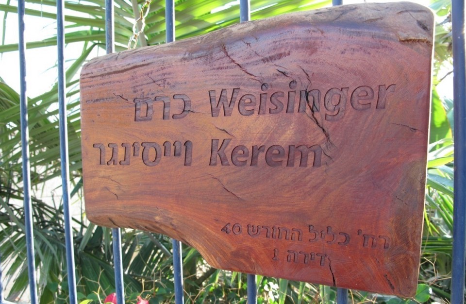 Laser Engraving on anoutdoor wood sign at the entrance to the house