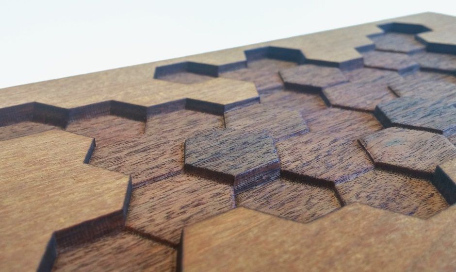 Wood paneling with laser engraving in variable depths