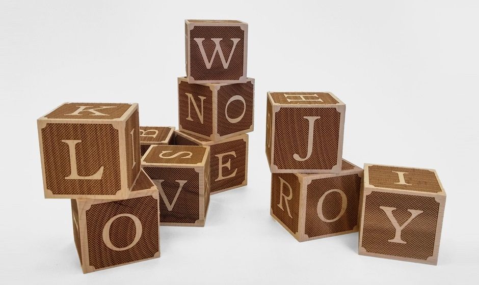 Laser engraving of letters on Beech wood